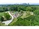 Aerial view of neighborhood playground and green space, with a skyline in the background at 1180 Brookhaven Park Ne Pl, Brookhaven, GA 30319