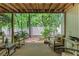 Cozy covered back porch with rocking chairs, overlooking a serene and private wooded yard at 1180 Brookhaven Park Ne Pl, Brookhaven, GA 30319