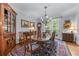 Elegant dining room featuring a large table, chandelier, and access to the outdoor area at 1180 Brookhaven Park Ne Pl, Brookhaven, GA 30319