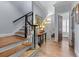 Inviting foyer with hardwood floors, staircase, and a glimpse of the front door at 1180 Brookhaven Park Ne Pl, Brookhaven, GA 30319