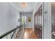 Upstairs hallway features hardwood floors, staircase and natural light at 1180 Brookhaven Park Ne Pl, Brookhaven, GA 30319