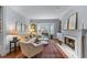 Comfortable living room with a fireplace, neutral tones, and large windows for natural light at 1180 Brookhaven Park Ne Pl, Brookhaven, GA 30319