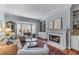 Bright living room featuring a fireplace, bay window, and hardwood floors at 1180 Brookhaven Park Ne Pl, Brookhaven, GA 30319