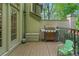 Outdoor patio space with a grill and outdoor seating for al fresco dining at 1180 Brookhaven Park Ne Pl, Brookhaven, GA 30319