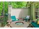 Cozy patio space with comfortable seating and a fire pit, perfect for outdoor entertaining at 1180 Brookhaven Park Ne Pl, Brookhaven, GA 30319