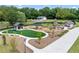 Playground featuring picnic shelter, modern play structures, swings, and open green space at 1180 Brookhaven Park Ne Pl, Brookhaven, GA 30319