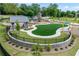 Community playground with a covered picnic area, modern play structures, and artificial turf at 1180 Brookhaven Park Ne Pl, Brookhaven, GA 30319
