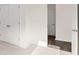 Bedroom with carpet and view of wood floor in next room at 13250 Tolstoy Dr, Covington, GA 30014