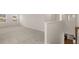 Upstairs hallway with carpet and ample natural light at 13250 Tolstoy Dr, Covington, GA 30014