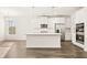 Open kitchen featuring a center island, stainless steel appliances, and pendant lighting at 13250 Tolstoy Dr, Covington, GA 30014