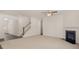 Cozy living room with fireplace and new carpeting at 13250 Tolstoy Dr, Covington, GA 30014
