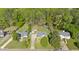 An aerial view of three homes with green lawns, trees, and ample parking at 198 Wiley Dr, Douglasville, GA 30134