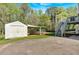 Backyard featuring a storage shed and deck with stairs at 198 Wiley Dr, Douglasville, GA 30134