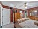 Bright bedroom featuring neutral carpet and a wooden four-poster bed at 198 Wiley Dr, Douglasville, GA 30134
