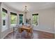 Bright dining room featuring wood floors, a chandelier, and views of the outdoors at 198 Wiley Dr, Douglasville, GA 30134