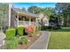 Inviting single-story home with a lovely front porch, manicured garden, and a stone walkway leading to the entrance at 198 Wiley Dr, Douglasville, GA 30134