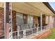 Inviting front porch adorned with vintage railings and comfortable seating, perfect for relaxing outdoors at 2044 Yucca Dr, Decatur, GA 30032