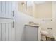 Bathroom features a granite vanity top, white tile walls, and updated fixtures at 2925 Heather Dr, Atlanta, GA 30344
