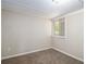 Cozy bedroom with neutral carpet, white trim, a ceiling fan, and natural light at 2925 Heather Dr, Atlanta, GA 30344