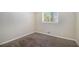 Bright bedroom with a window and carpeted floors in neutral tones at 2925 Heather Dr, Atlanta, GA 30344