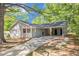 Charming single-story home with grey siding, carport, well-maintained lawn, and mature shade trees at 2925 Heather Dr, Atlanta, GA 30344