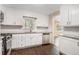 Well-lit kitchen with white cabinets, granite countertops, stainless steel appliances, and tile backsplash at 2925 Heather Dr, Atlanta, GA 30344