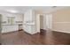 Bright kitchen with white cabinets, stainless steel appliances, granite countertops, and dark hardwood flooring at 2925 Heather Dr, Atlanta, GA 30344
