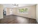 Bright living room with hardwood floors, natural light from the window, and white trim at 2925 Heather Dr, Atlanta, GA 30344