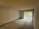 Comfortable bedroom with natural light and neutral carpet at 323 Seasons Pkwy, Norcross, GA 30093