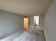 Neutral bedroom with neutral carpet and entrance to bathroom at 323 Seasons Pkwy, Norcross, GA 30093