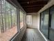 Long enclosed porch with floor to ceiling windows offering natural light and outdoor views at 323 Seasons Pkwy, Norcross, GA 30093