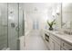Bathroom with glass shower, soaking tub, and double sink vanity with white countertops at 334 Sutherland Ne Pl, Atlanta, GA 30307