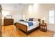 A bright bedroom features hardwood floors, a ceiling fan, and natural light at 334 Sutherland Ne Pl, Atlanta, GA 30307