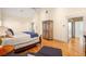 A bright bedroom with hardwood floors leads into the bathroom at 334 Sutherland Ne Pl, Atlanta, GA 30307