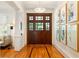 Gracious foyer featuring hardwood floors, an elegant chandelier, and beautiful wall art at 334 Sutherland Ne Pl, Atlanta, GA 30307