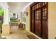Cozy front porch with brick flooring and comfortable seating area near a wood front door at 334 Sutherland Ne Pl, Atlanta, GA 30307