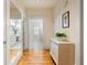 Hallway with mirror and built in dresser that leads to a bathroom at 334 Sutherland Ne Pl, Atlanta, GA 30307