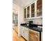 A wet bar area includes glass-front cabinets, a wine fridge, sink, and coffee maker at 334 Sutherland Ne Pl, Atlanta, GA 30307