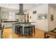 Bright kitchen with a center island, stainless steel appliances, and hardwood floors, perfect for cooking and entertaining at 334 Sutherland Ne Pl, Atlanta, GA 30307