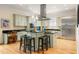 Modern kitchen with stainless steel appliances, a center island with seating, and ample cabinet space for storage at 334 Sutherland Ne Pl, Atlanta, GA 30307