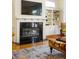 Charming living room with a fireplace, custom built-ins, and stylish decor creating a warm, sophisticated ambiance at 334 Sutherland Ne Pl, Atlanta, GA 30307