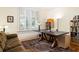 Comfortable office space with a large desk and shelves, perfect for a home office at 334 Sutherland Ne Pl, Atlanta, GA 30307