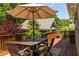 Outdoor dining area with an umbrella-covered table and chairs, offering a perfect spot for enjoying meals outside at 334 Sutherland Ne Pl, Atlanta, GA 30307
