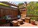 Cozy outdoor seating area with a wooden bench and small tables, ideal for relaxation and enjoying the outdoors at 334 Sutherland Ne Pl, Atlanta, GA 30307