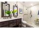 Modern bathroom with a double vanity, glass shower, and elegant fixtures at 1002 Forrest Blvd, Decatur, GA 30030