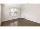 Bright bedroom featuring hardwood floors, large windows, and closet at 1002 Forrest Blvd, Decatur, GA 30030