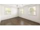 Bright bedroom featuring hardwood floors, white walls, and plenty of natural light at 1002 Forrest Blvd, Decatur, GA 30030
