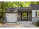 Charming home featuring a one-car garage, covered porch, and inviting curb appeal at 1002 Forrest Blvd, Decatur, GA 30030