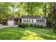 Charming single-story home features lush landscaping and an inviting exterior at 1002 Forrest Blvd, Decatur, GA 30030