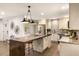 Open kitchen features a large island, stainless steel appliances, and ample cabinet space at 1002 Forrest Blvd, Decatur, GA 30030